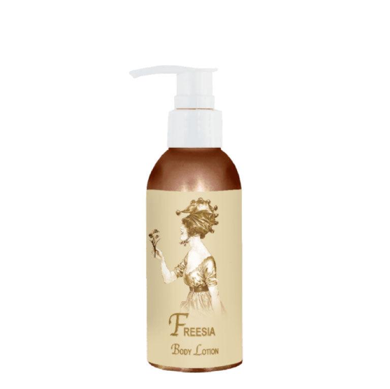 Freesia Body Lotion 4oz with French fragrances, aloe, and vitamin E for youthful skin elasticity.