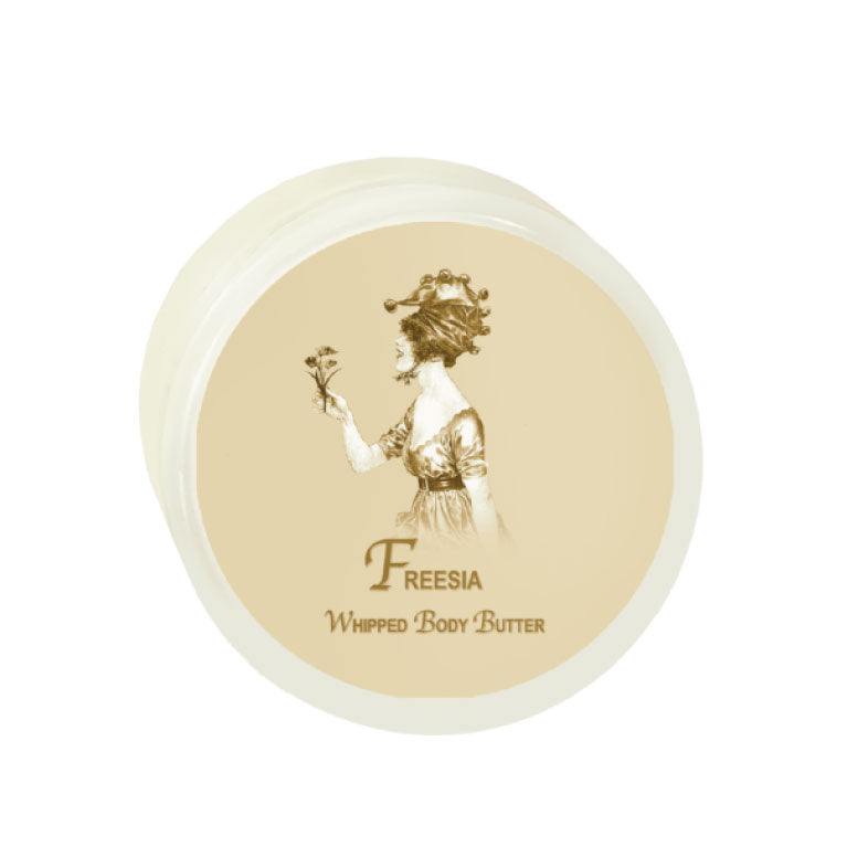 Freesia Argan Oil Whipped Body Butter in 8oz jar for deep skin hydration.