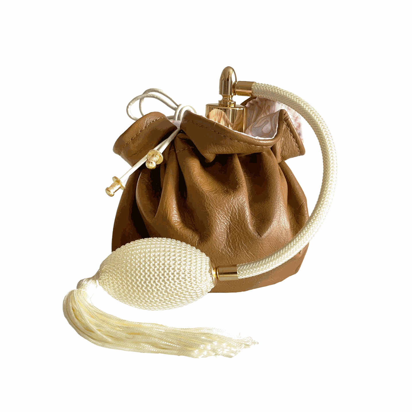 French perfume in clear round glass bottle, Gold bulb sprayer with antique tassel and Beautifully boxed and enveloped in a reversible leather pouch.