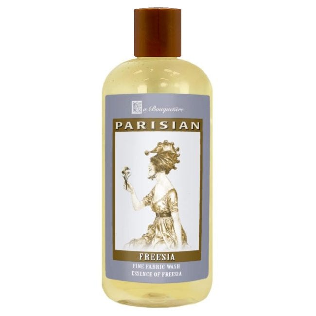 Freesia Fine Fabric Wash 19oz bottle with premium French liquid detergent, suitable for HE and conventional machines, eco-friendly, and cruelty-free.