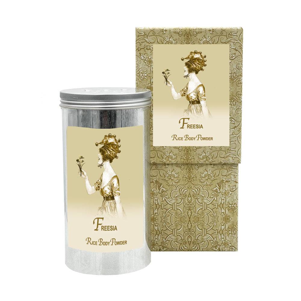 Freesia Rice Body Powder in aluminum canister with elegant packaging.