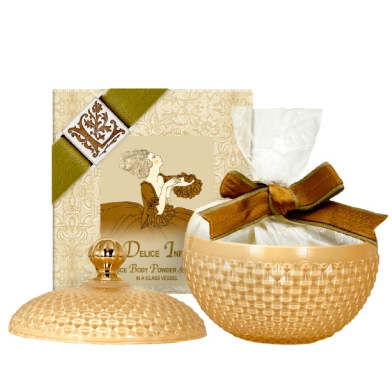 Delice Infini Rice Body Powder in a decorative glass vessel with lid, featuring an elegant design and optional Australian powder puff.