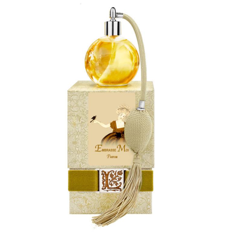 Embrasse Moi French Perfume with gold tassel sprayer in elegant glass bottle.