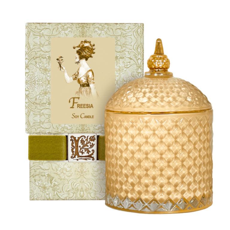 Freesia Luxury Soy Candle in decorative glass jar with elegant packaging.