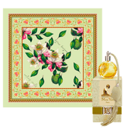 Silk scarf with floral design and hand-rolled edges.