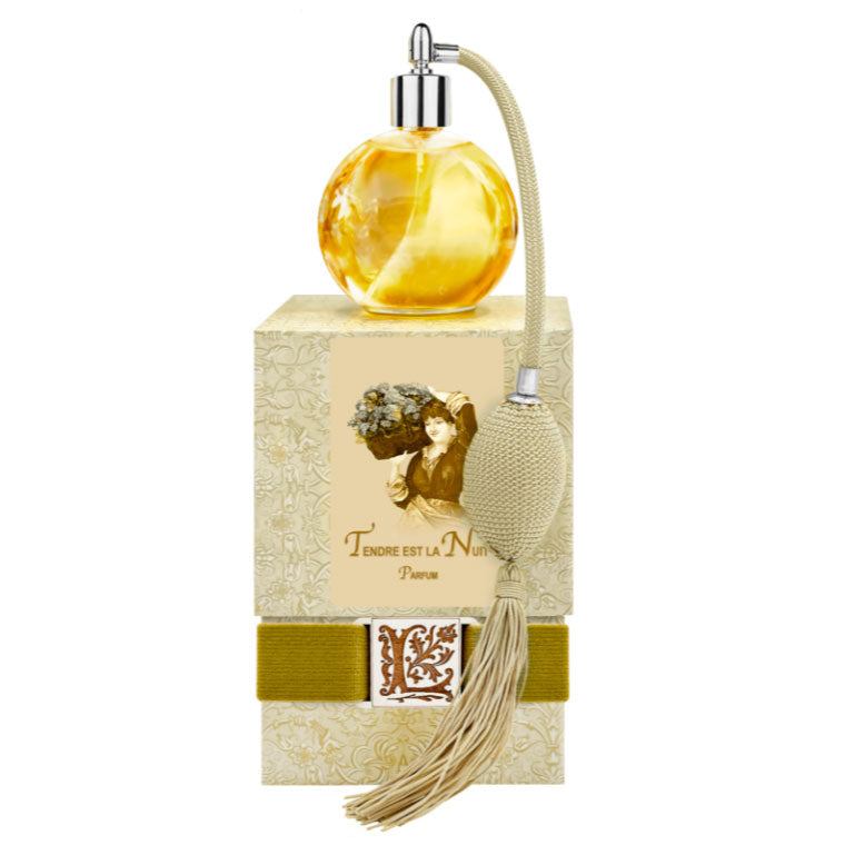 Tendre est la Nuit French perfume in clear round glass bottle with gold bulb sprayer and tassel, beautifully boxed.