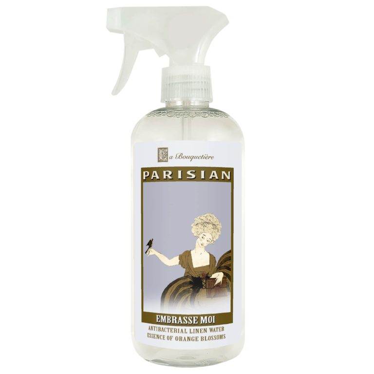 Embrasse Moi Antibacterial Linen Water 19oz bottle with French-inspired design.