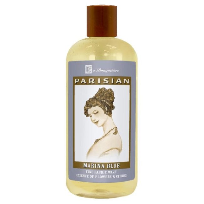 Premium French liquid detergent, eco-friendly 19oz bottle with essential oils, suitable for HE and conventional machines.