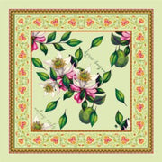 Luxurious green silk scarf with floral design and hand-rolled edges.